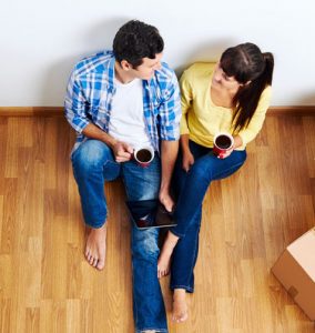 Couple booking home cleaning appointment online